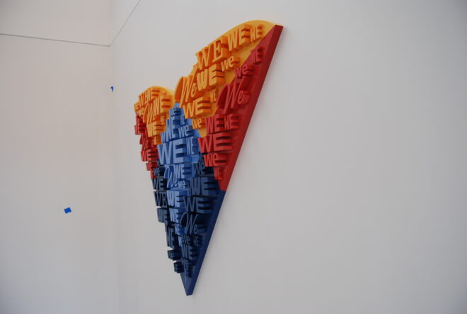 Branded office wall installation with colorful layered acrylic lettering and dimensional design