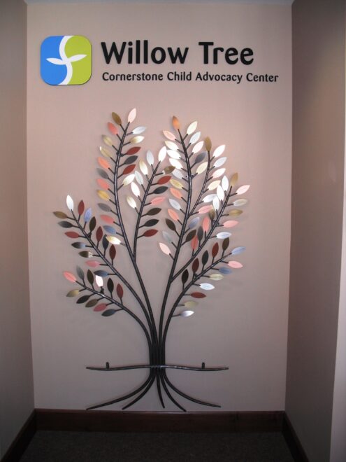 Decorative thin gauge metal tree installation with custom-engraved leaves
